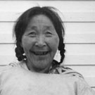 Photograph of the Nujaaqtu sisters, two older Inuit women, smiling. Atuat is on the left. Arctic Bay (Ikpiarjuk/Tununirusiq), Nunavut, 1950