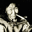 Photograph of Kalluk and her son, Nutarakituq, taken at an unknown location in Nunavut, 1952. The people in this photograph were identified by Elder Louis Uttak during his research at Library and Archives Canada, Ottawa, October 2005