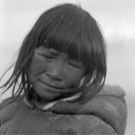 Photograph of Inuit boy Atigilik wearing a caribou tunic, Pond Inlet (Mittimatalik/Tununiq), Nunavut, circa 1924